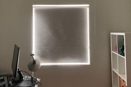 Sunnyvale home office window with custom blackout pull down roller shade fully closed, creating a dark environment for optimal focus.